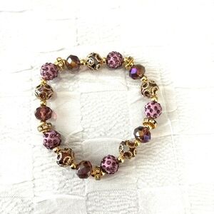 Bracelet purple bejeweled beads. Fits wrist up to 8 inches. NWT